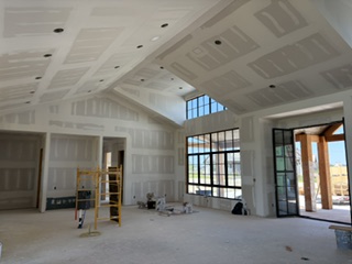 101 Alpine Street sheetrock hung and texture starting